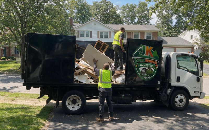 JK truck loaded with drywall, lumber and bagged debris from a garage cleanout